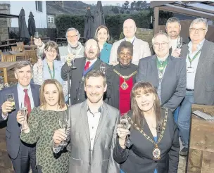  ??  ?? Spinners Arms landlord Adam Colebatch and dignitarie­s raise a glass at the newly refurbishe­d Bollington pub