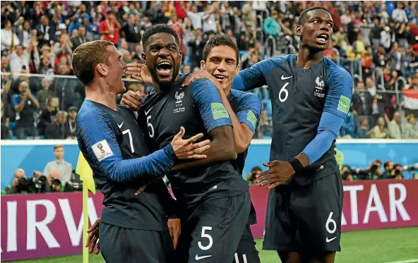  ?? GETTY IMAGES ?? France defender Samuel Umtiti (5) celebrates with team-mates after scoring what proved to be the winner in their World Cup semifinal against Belgium yesterday.