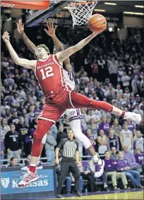  ?? [AP PHOTO/ORLIN WAGNER] ?? Oklahoma's Austin Reaves (12) is fouled by Kansas State's Montavious Murphy during the first half of Wednesday's Big 12 basketball game in Manhattan, Kan.