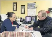  ?? ADAM BEAM/AP ?? David Ermold files to run for Rowan County Clerk as Clerk Kim Davis looks on last December in Morehead, Ky.