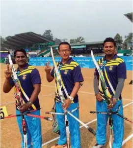  ?? — PTI ?? Archers Gurcharan Besra ( from left), Tarundeep Rai and Jayanta Talukdar celebrate after winning gold in the recurve team event at the 12th South Asian Games in Shillong on Tuesday.