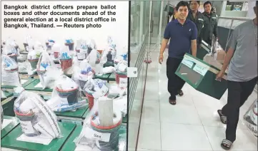  ?? — Reuters photo ?? Bangkok district officers prepare ballot boxes and other documents ahead of the general election at a local district office in Bangkok, qhailandK