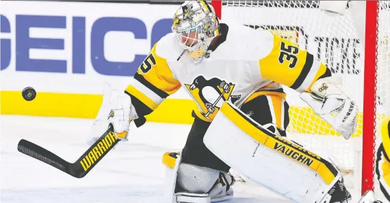  ?? STEPHEN R. SYLVANIE/USA TODAY SPORTS ?? Pittsburgh Penguins goaltender Tristan Jarry has taken over as the team’s regular starter thanks to his terrific first-half numbers.