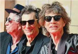  ?? Text and photos by wire services Daniel Leal/AFP/Getty Images/TNS ?? From left, Keith Richards, Ron Wood and Mick Jagger of the Rolling Stones arrive at a launch event for their upcoming album in London on Wednesday.