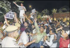  ?? PTI ?? Delhi Congress workers protest outside Kapil Sibal’s residence in New Delhi on Wednesday.