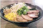  ??  ?? Sapporo Ramen’s miso ramen includes sweet corn, bamboo shoots, bean sprouts, pork green onion and bok choy.