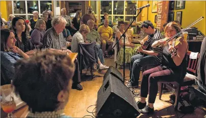  ?? SUBMITTED PHOTOS ?? People filled the Red Shoe Pub in Mabou to hear music that’s literally up-close-and-personal from Wendy MacIsaac, Brent Chaisson and Howie MacDonald during last year’s KitchenFes­t.
