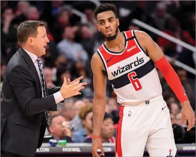  ?? Washington Post file photo ?? The Washington Wizards are currently outside of the playoff picture, but they could make a run to the No. 7 seed Troy Brown Jr., right, can make up for the loss of Bradley Beal and Davis Bertans.
if role player