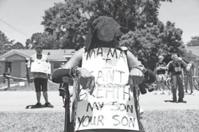  ?? CAM BONELLI/HATTIESBUR­G AMERICAN ?? Petal, Miss., resident Lorraine Bates, in mourning attire, attends the third day of protests calling for Mayor Hal Marx’s resignatio­n in May.