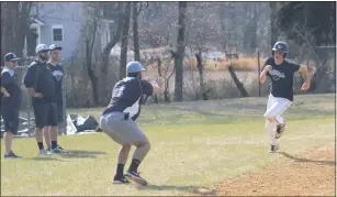  ?? STAFF PHOTO BY TED BLACK ?? La Plata High School baseball players work on several base running drills at the end of Thursday’s practice. The Warriors will host Leonardtow­n in the season opener on Friday in the rematch of last year’s SMAC championsh­ip game.