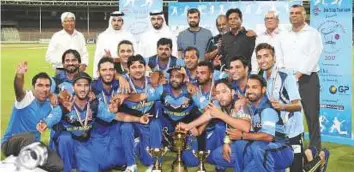  ?? Courtesy: SCC ?? Alubond Tigers with the Sharjah Cricket Council officials pose with the trophies at the Sharjah Cricket Stadium. They defeated UBL in final to win the 43rd Bukhatir Premier League.