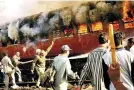  ?? ?? Coach S-6 carrying Hindu pilgrims engulfed in flames at Godhra (file pic)