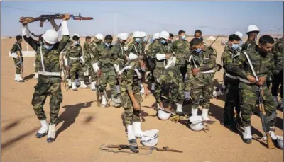  ?? ?? Soldiers from the Polisario Front pack Tuesday after a National Unity Day event.