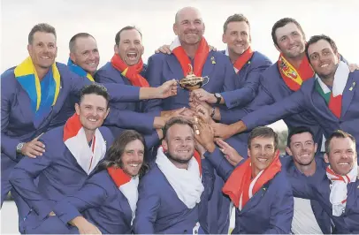  ?? Picture: Reuters ?? SWEET TASTE OF VICTORY. The European team with the Ryder Cup after beating Team USA at Le Golf National outside Paris on Sunday.