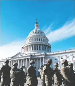  ?? Rod LAMKEY/POOL/AFP VIA GETTY IMAGES ?? Members of the National Guard arrive at the U.S. Capitol
ahead of Wednesday’s inaugurati­on of Joe Biden.