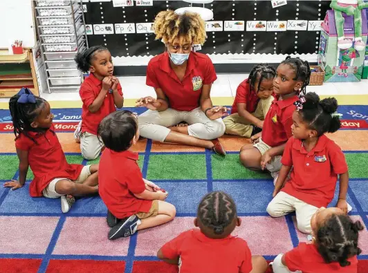  ?? Photos by Jon Shapley / Staff photograph­er ?? Amber Bygrave, top center, a prekinderg­arten teacher, leads a learning activity with her students Oct. 26 at Cradles 2 Crayons Early Learning Academy in Houston. The center has kept its pricing the same despite the pandemic.