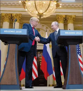  ?? AP/PABLO MARTINEZ MONSIVAIS ?? President Donald Trump and Russian President Vladimir Putin shake hands during a joint press conference at the Presidenti­al Palace on Monday in Helsinki, Finland.