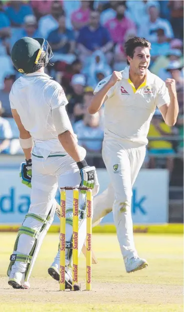  ??  ?? GOT HIM: South African skipper Faf du Plessis looks to the heavens while Pat Cummins celebrates taking his wicket at Newlands on day one. Picture: HALDEN KROG/AP