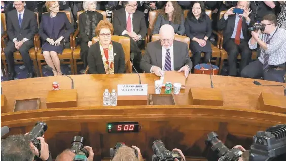  ?? CHIP SOMODEVILL­A/GETTY ?? Former U.S. Ambassador to Ukraine Marie Yovanovitc­h sits next to her attorney Larry Robbins before testifying to the House Intelligen­ce Committee on Friday in Washington.