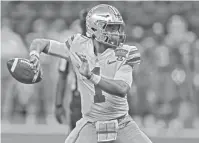  ?? CHUCK COOK/USA TODAY SPORTS ?? Ohio State quarterbac­k Justin Fields attempts a pass against Clemson at the Allstate Sugar Bowl in New Orleans on Jan. 1.