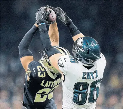  ?? JONATHAN BACHMAN GETTY IMAGES ?? New Orleans’ Marshon Lattimore had two intercepti­ons against the Eagles on Sunday. This one was during the second quarter.