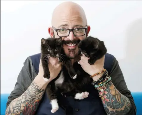  ?? THE ASSOCIATED PRESS ?? In this photo, TV personalit­y Jackson Galaxy, from the Animal Planet series, “My Cat From Hell,” poses for a portrait in New York to promote his latest book, “Total Cat Mojo: The Ultimate Guide To Life With Your Cat.”