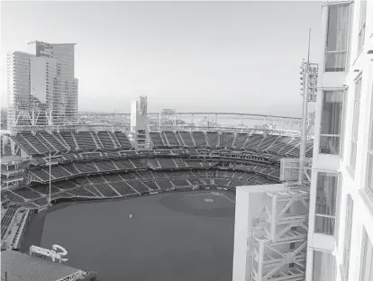  ?? COURTESY PHOTO ?? This is the view of Petco Park from the leased condo of financial planner Chip Messenger on the 15th floor of The Legend.