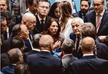  ?? Craig Ruttle/associated Press ?? Russia’s U.N. Ambassador Vassily Nebenzia, center right, and China’s U.N. Ambassador Zhang Jun, center left, confer with ambassador­s of Arab countries before a Security Council meeting.