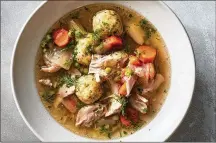  ?? FOOD STYLED BY SIMON ANDREWS. PHOTO BY JOHNNY MILLER/THE NEW YORK TIMES ?? Chicken matzo ball stew in New York on Nov. 10. This light recipe is still filling and festive enough for Hanukkah, and it’s easy to clean up, too.