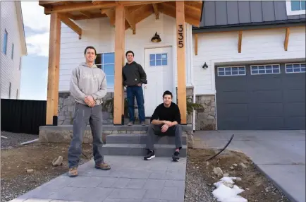  ?? COURTESY PHOTO — JESSE MORGAN PETERSEN ?? From left: Matt Morris, George Kurtz and Daniel Donado stand in front of Morris’s home, which the three helped rebuild.