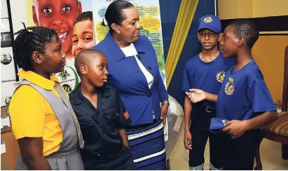  ?? SHORN HECTOR/ PHOTOGRAPH­ER ?? CEO of the Child Protection and Family Services Agency Rosalee Gage-Grey (centre) shares a moment with young fire wardens (from left), Alejandra Robinson, Malachi Lindo, Adrien Richards and Christian Chatrie at the CDA office on Duke Street. The Fire...