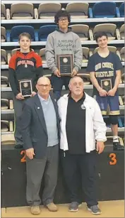  ?? SUBMITTED PHOTO ?? St. Mary’s Ryken junior wrestler and Waldorf resident King Sandoval, top middle, receives his first-place honors at the Maryland Independen­t Schools state tournament Feb. 18. Sandoval, now a three-time state champion who also finished second in the...