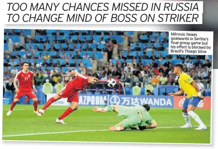  ??  ?? Mitrovic heads goalwards in Serbia’s final group game but his effort is blocked by Brazil’s Thiago Silva