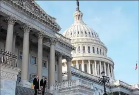  ?? SUBMITTED PHOTO ?? U.S. Reps. Ryan Costello, left, and Pat Meehan leave the U.S. Capitol Thursday after casting votes on a bill that averts automatic cuts to Medicare and Social Security and keeps the government open through mid-January.