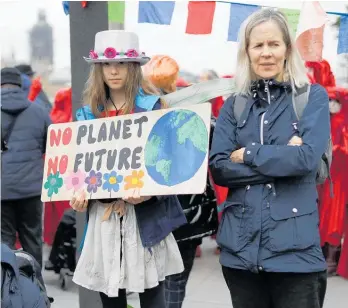  ?? Photo / AP ?? People protest climate change inaction in London this month.