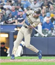  ?? USA TODAY SPORTS ?? Padres outfielder Jackson Merrill gets a base hit against the Brewers in the fifth inning at American Family Field.