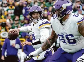  ?? Morry Gash/Associated Press ?? Quarterbac­k Kirk Cousins played in only eight games for the Vikings last season because of a torn Achilles tendon in his right foot.