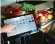  ??  ?? The Winnow system allows chefs to use a tablet app to identify discarded food. Combined with data from an electronic scale, the smart meter tells them the value of what is going waste.