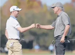  ?? PHELANEBEN­HACK/AP ?? Justin Thomas, left, and his father MikeThomas exchange fist-bumps afterfinis­hing their final round at thePNCCham­pionship on Sunday in Orlando, Florida.