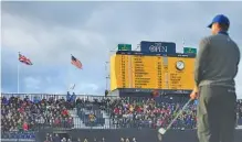  ?? AP PHOTO/JON SUPER ?? Tiger Woods prepares to chip onto the 18th green Thursday during the first round of the British Open golf tournament at Royal Portrush in Northern Ireland. Woods opened with a 78.