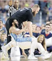  ?? David J. Phillip Associated Press ?? THE REF called it as North Carolina’s Joel Berry II was fouled by Gonzaga’s Przemek Karnowski.