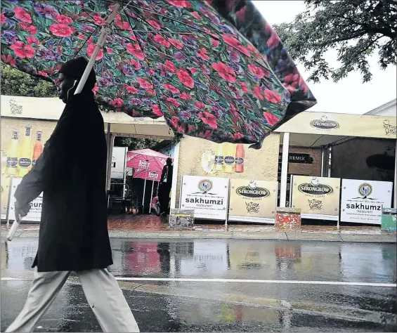  ?? PHOTO: THULANI MBELE ?? A man walks past the popular Sakhumzi Restaurant on Vilakazi Street in Soweto where a manager was shot dead by armed men who attempted to rob the eatery after close of business in the early hours of Sunday.