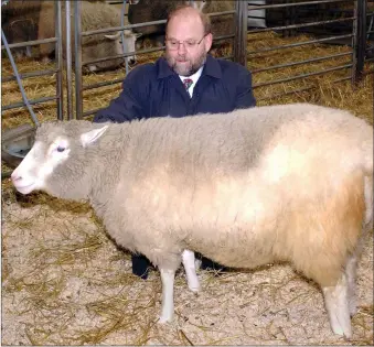  ??  ?? „ Scientist Ian Wilmut with Dolly the sheep, the world’s first clone of an adult mammal, at the Roslin Institute.