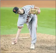  ?? TONY GUTIERREZ – THE ASSOCIATED PRESS ?? Giants reliever Tyler Rogers was unable to hold on to one-run leads in both the ninth and 10th innings against the Rangers.