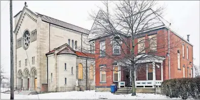  ?? [ERIC ALBRECHT/DISPATCH] ?? The Catholic Diocese of Columbus plans to demolish the unoccupied rectory of St. Dominic’s Church on the Near East Side. Some windows of the Queen Anne-style house are boarded up, as are some on the church next door, because of damage from the explosion of a nearby duplex in June.