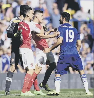  ?? Picture: PA ?? Chelsea striker Diego Costa, right. and Gabriel Paulista, centre, clash at Stamford Bridge