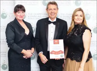  ?? Special to The Okanagan Weekend ?? Naramata’s Township 7 Winery won best Canadian sparkling wine with its 2016 Seven Stars Polaris at the Champagne and Sparkling Wine Championsh­ips in London, England. Pictured here accepting the award are Township 7 winemaker Mary McDermott, left, Township 7 general manager Mike Raffan and championsh­ips director Rachel Davey.