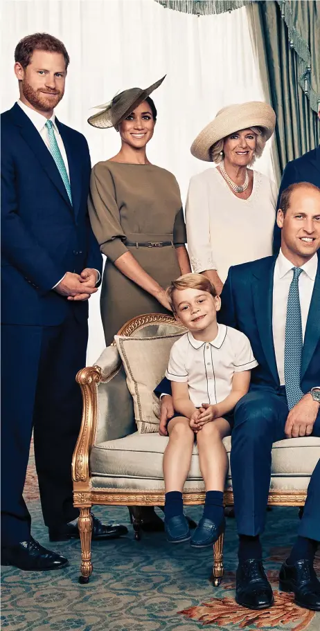  ??  ?? Sleeping through his big moment: Prince Louis rests on his mother’s lap as George, William and Charlotte sit alongside them. Standing behind them are, from left, Harry, Meghan, Camilla, Charles, Carole and Michael Middleton, Pippa and James Matthews,...