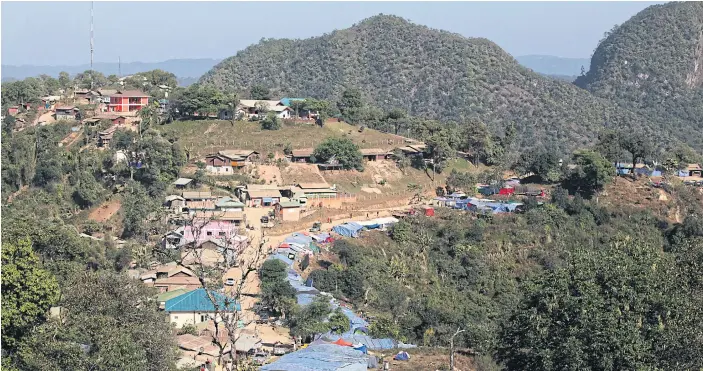  ??  ?? SCENE OF FESTIVITY: Loi Tai Leng, the site of a big Shan State National Day celebratio­n this year. The road leading to town was seized by Thai authoritie­s a few years ago and remains controlled by them to this day.