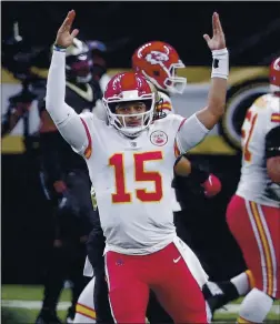  ?? BRETT DUKE – THE ASSOCIATED PRESS ?? Chiefs quarterbac­k Patrick Mahomes raises his arms in celebratio­n after throwing one of his three touchdown passes during Sunday’s game against the Saints.